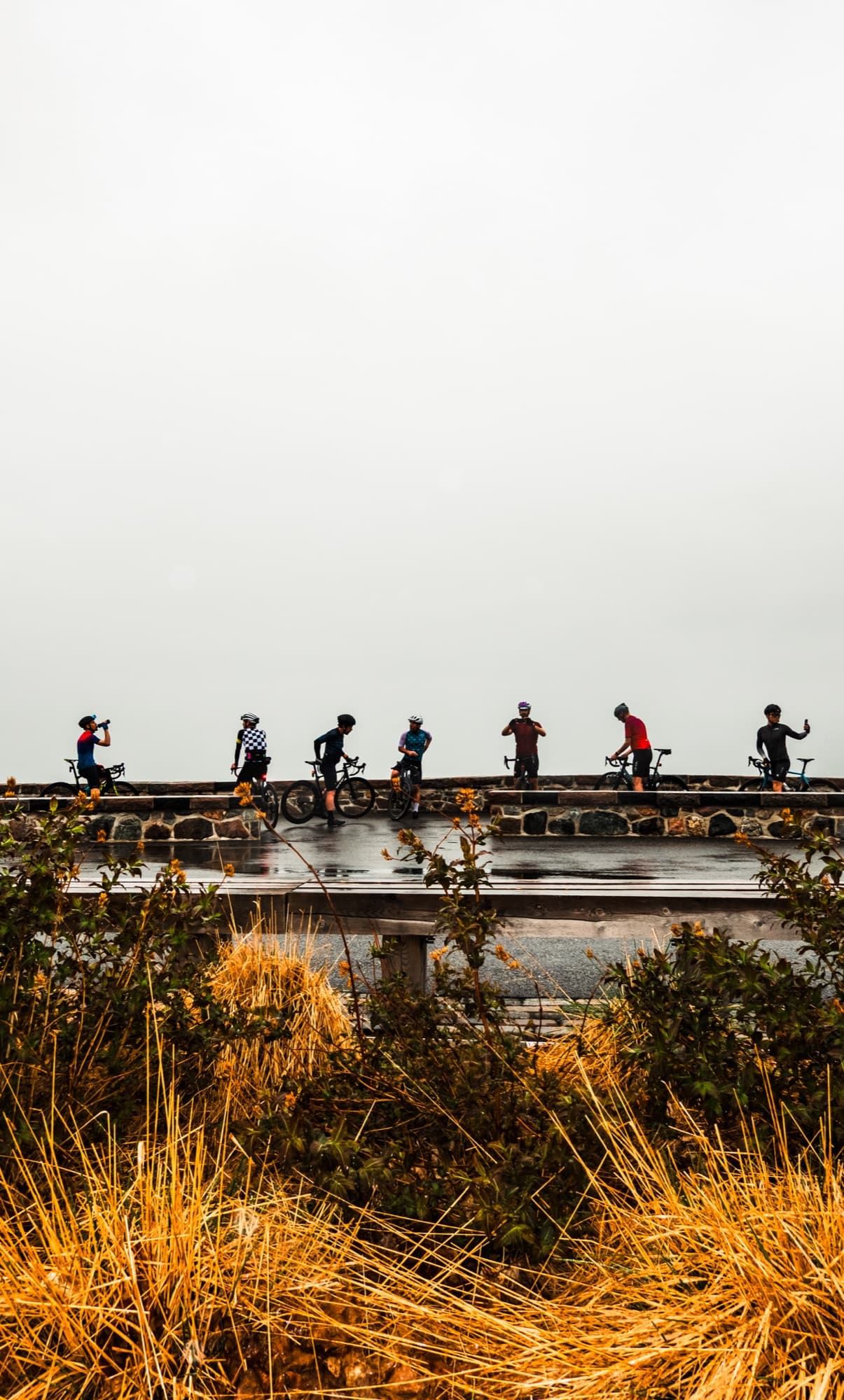 Riders on the lookout wall, fog behind