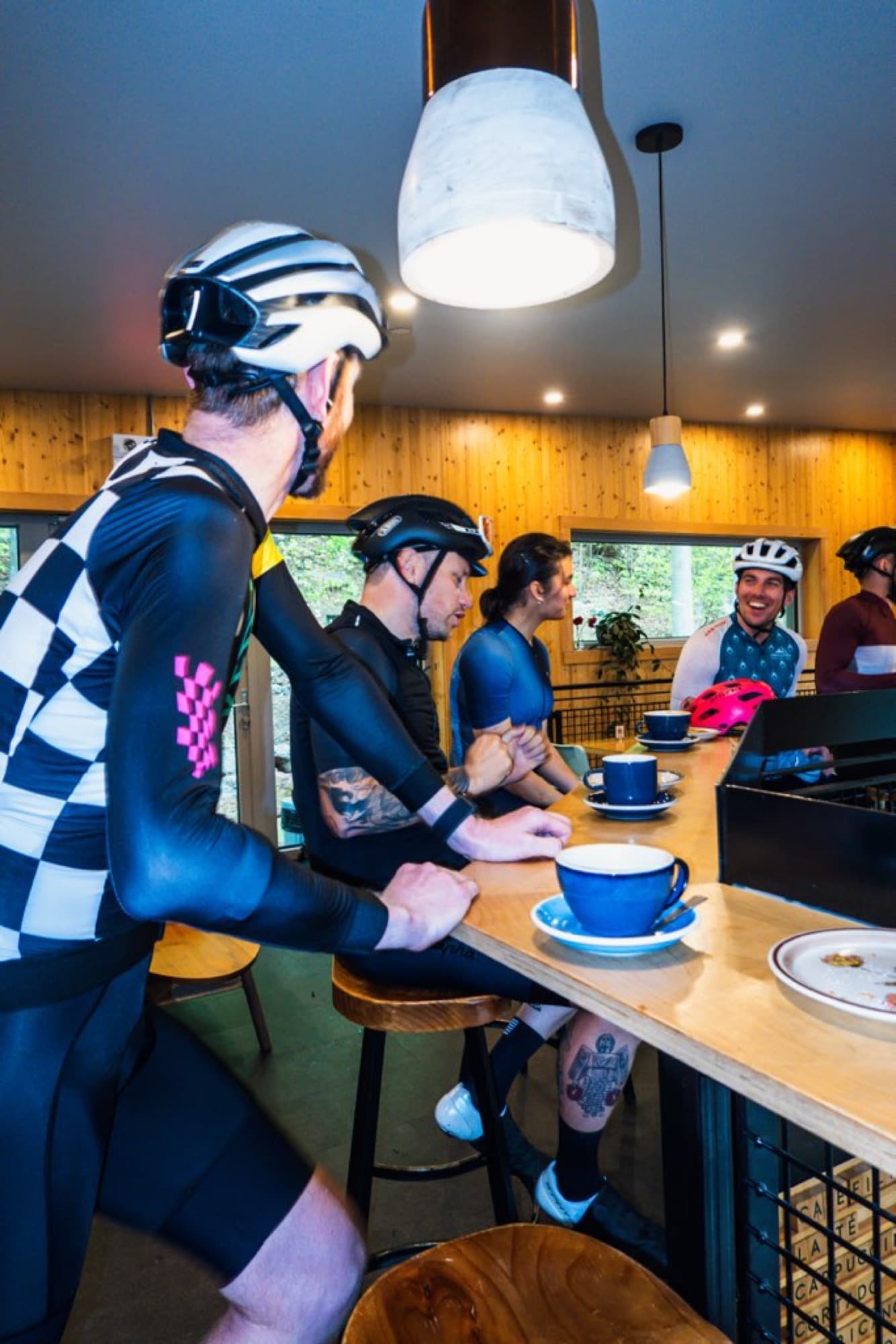 Coffee at the counter, helmets still on
