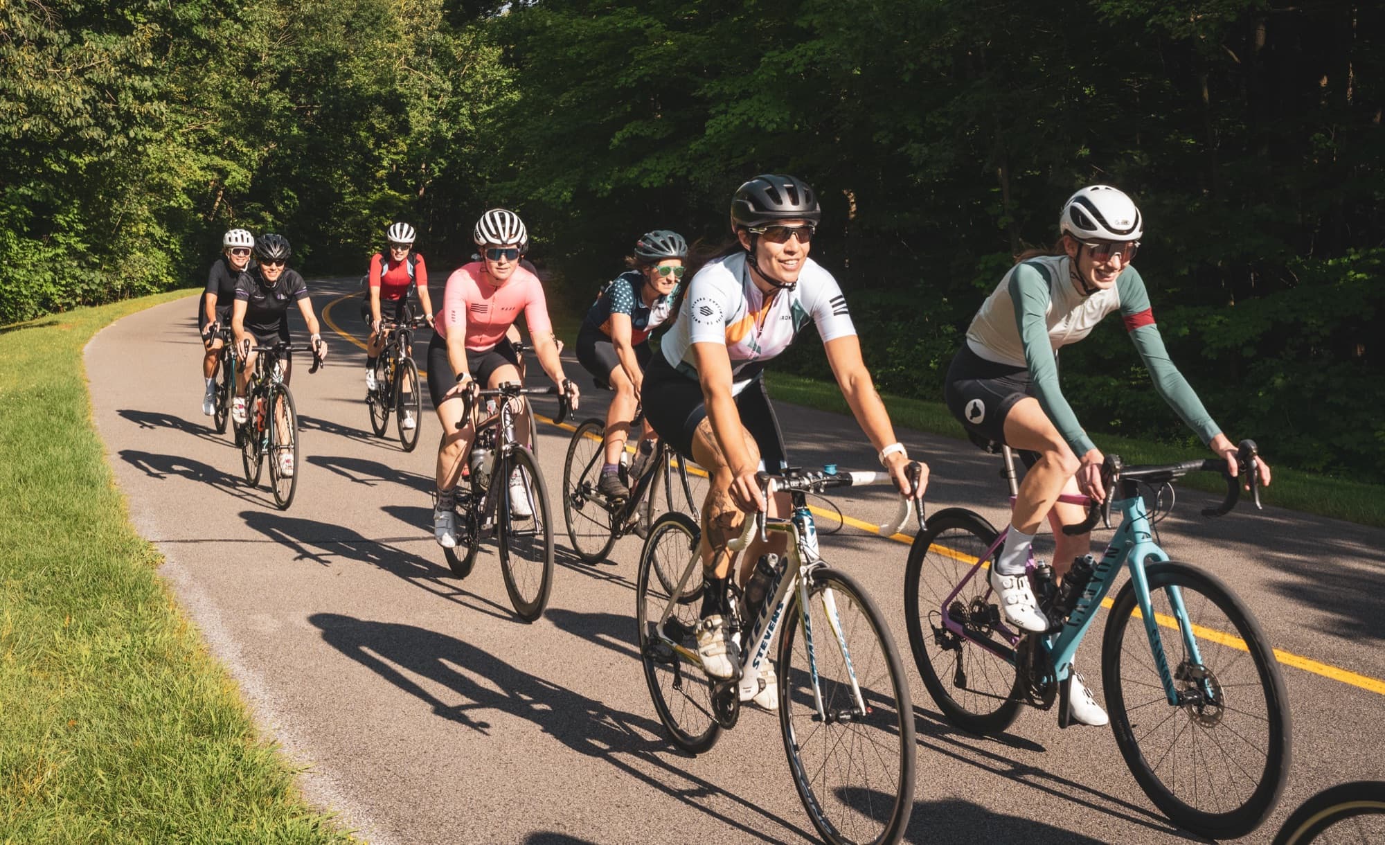 Riders side by side, all smiles, on the Gatineau Parkway