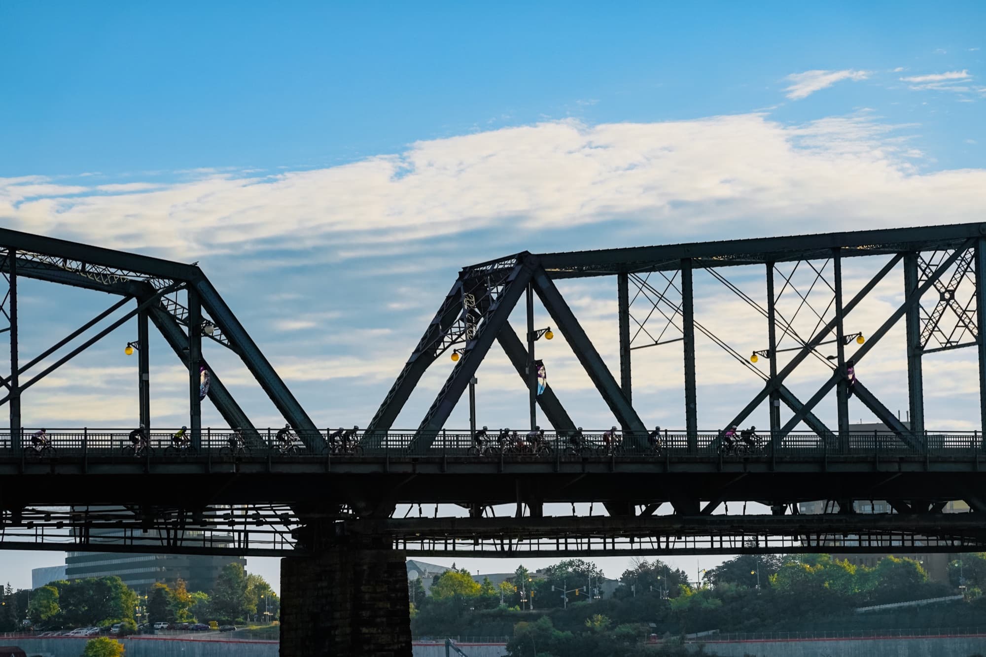 The group strung out across the bridge