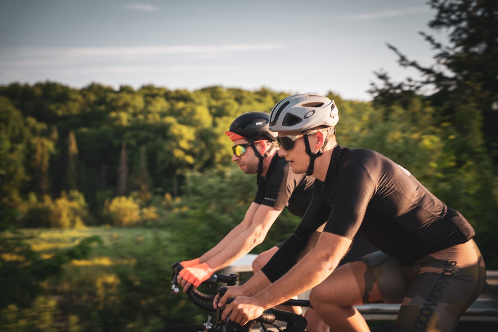 Two riders side by side on a climb