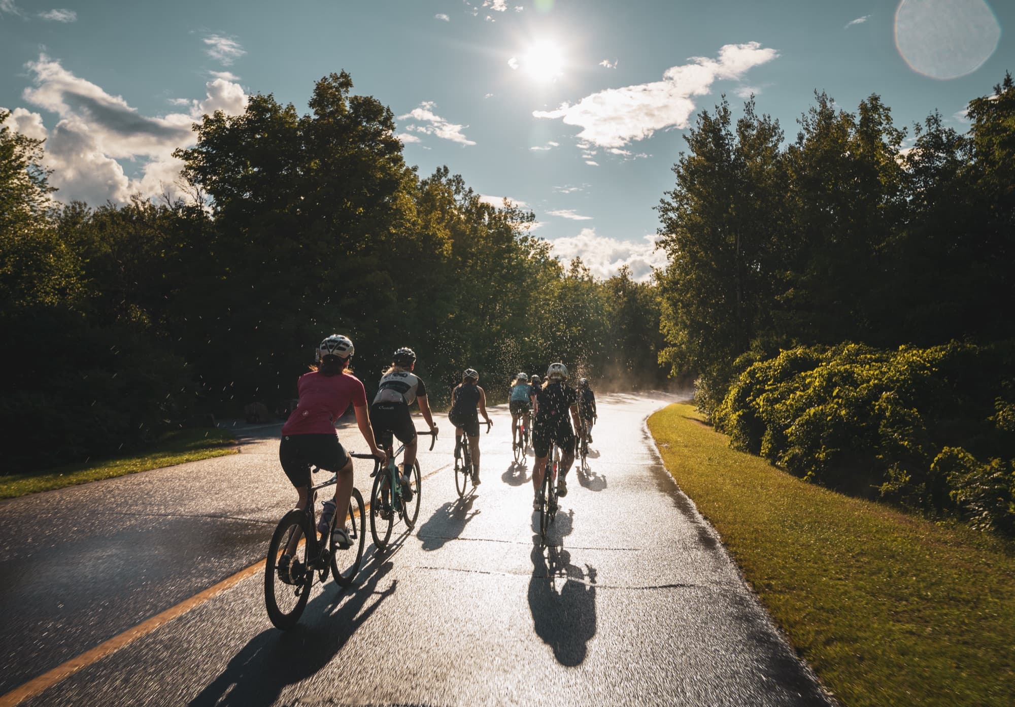 Riders on the Gatineau Parkway in evening sun